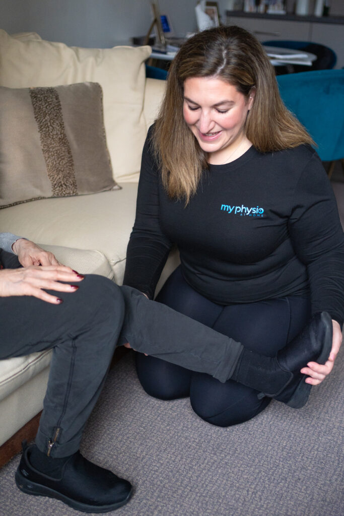 physio helping patient with leg