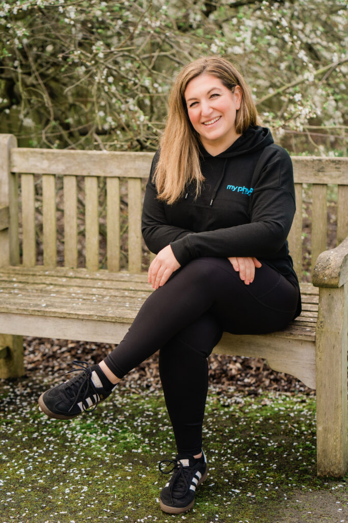 physiotherapist Stephanie Horn sitting on a bench in the garden